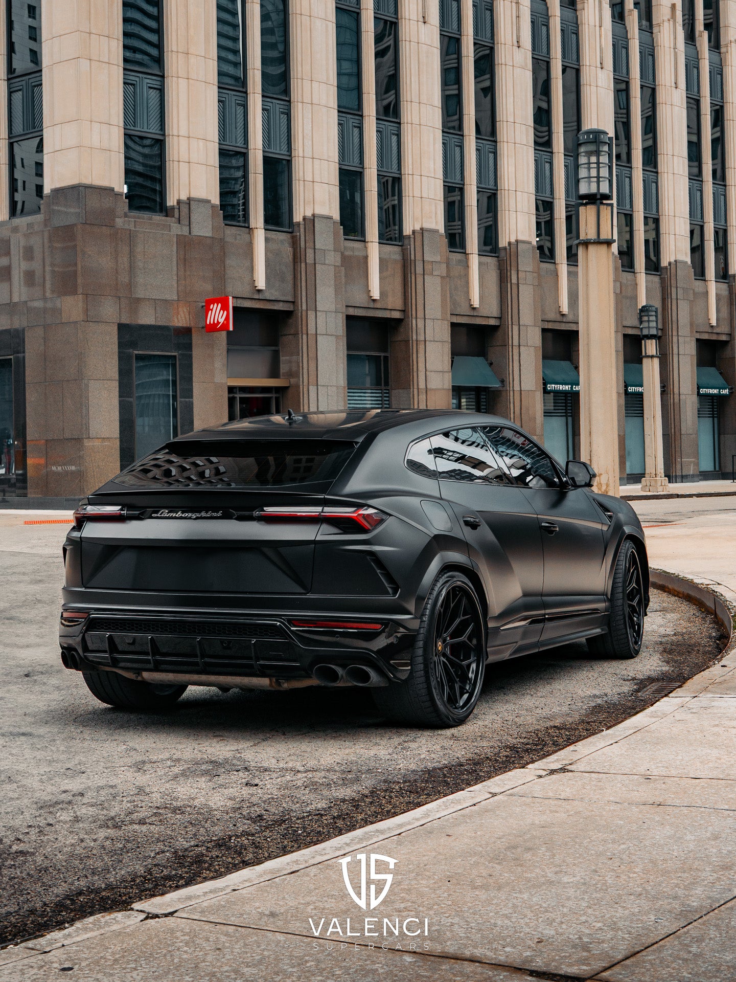 Lamborghini Urus close-up of the bold black grille featuring the iconic Lamborghini logo, showcasing its aggressive and luxurious SUV design.