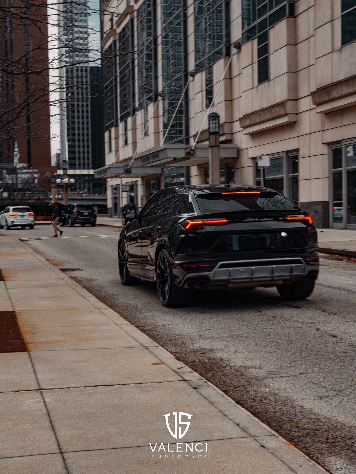 Black Lamborghini Urus rear view – performance SUV with 22-inch forged wheels