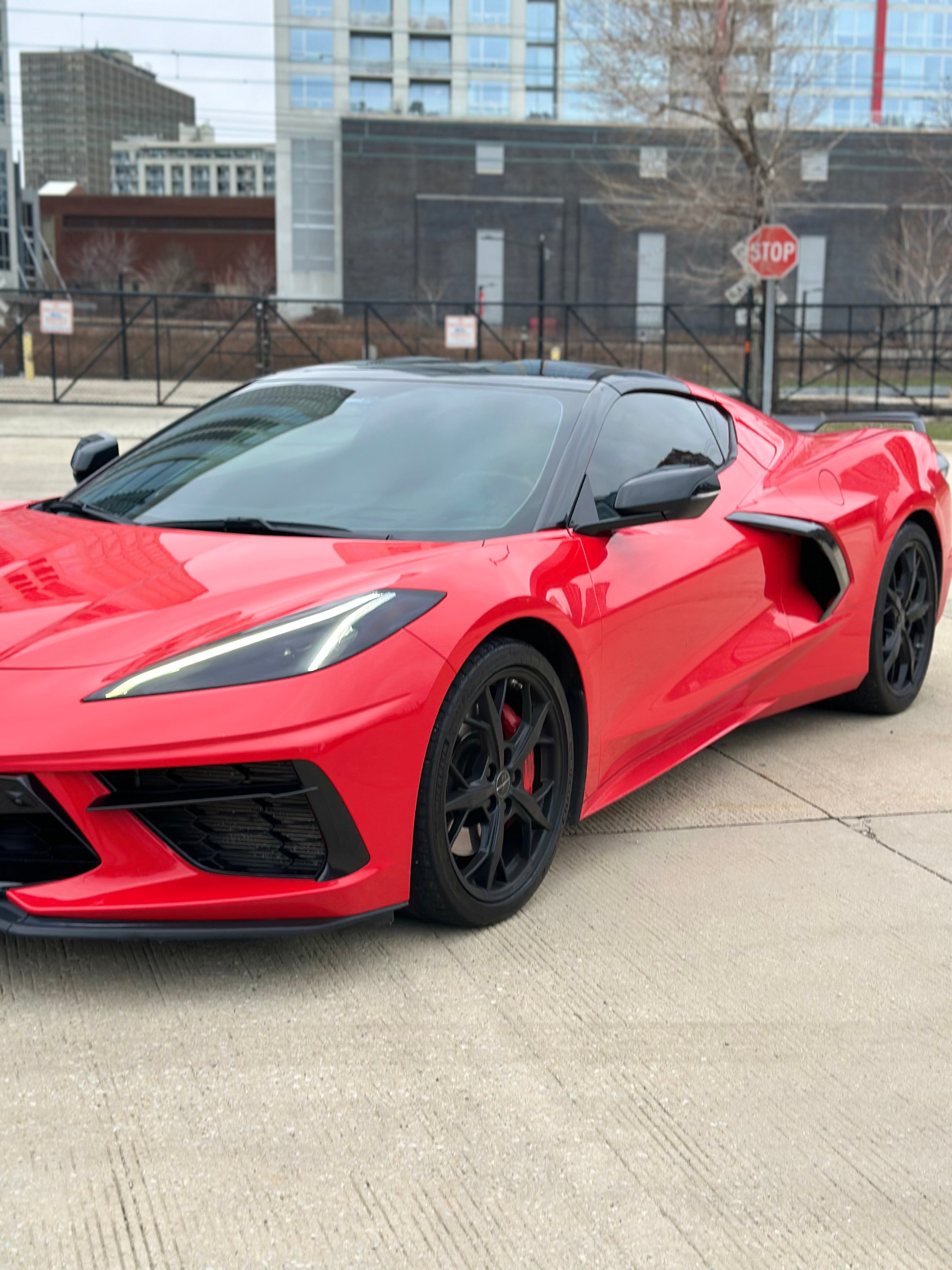 Red C8 Corvette side view – American performance car for rent